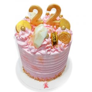 torta de crema en dorado y rosa